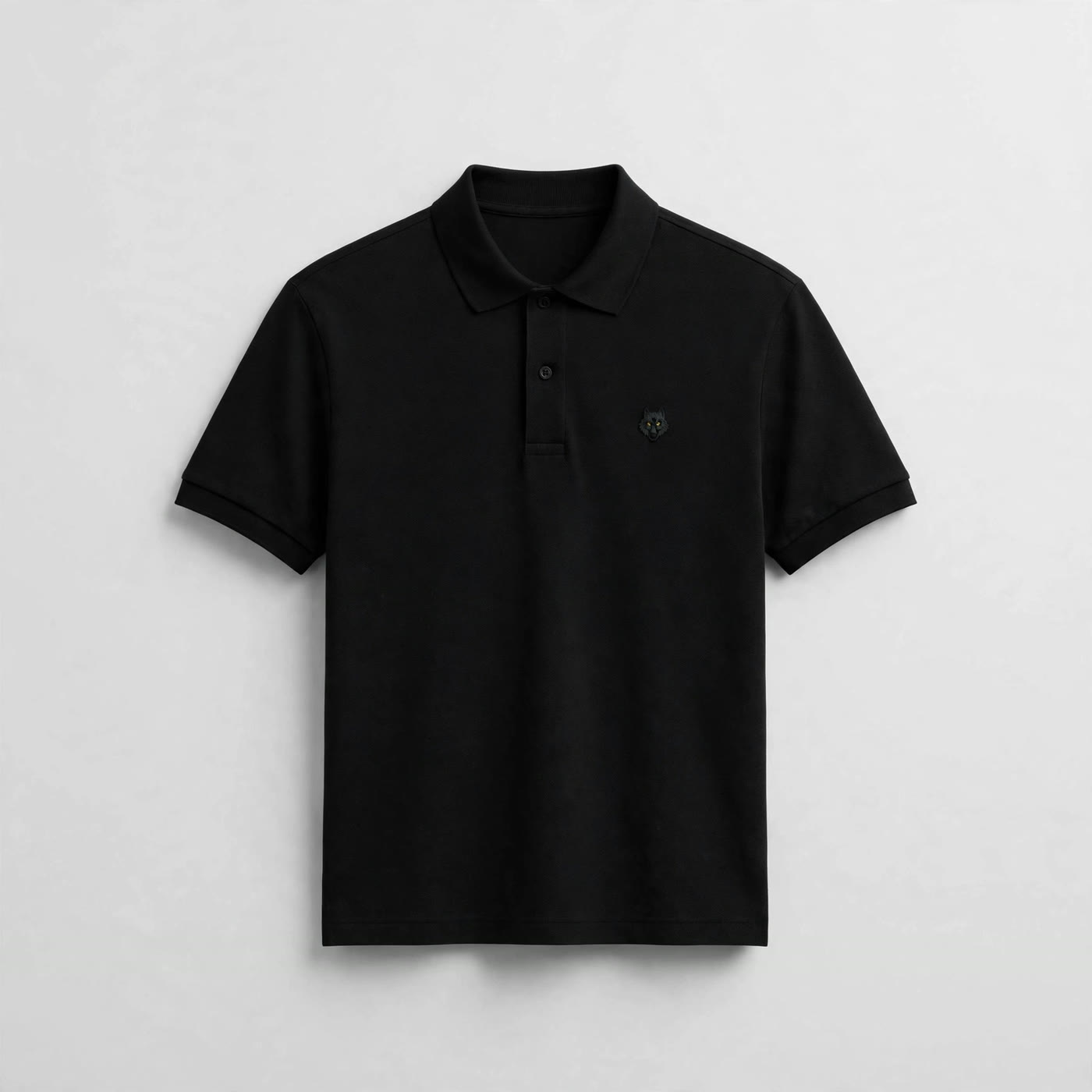 The Black Polo — black polo shirt with the embroidered wolf emblem on the chest